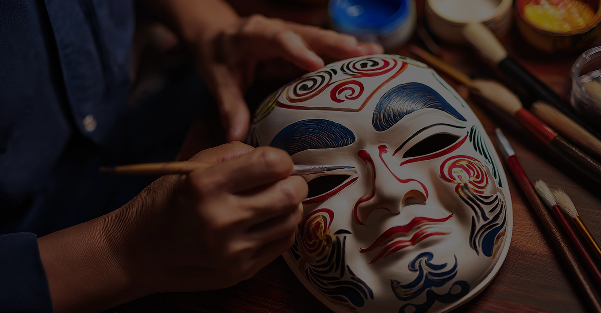 Hands Painting a Traditional Mask for Asian American